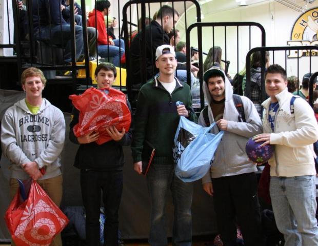 Men's Lacrosse Team Participates In Giving Of The Toys