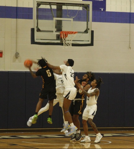 Broome player going up for a contested layup