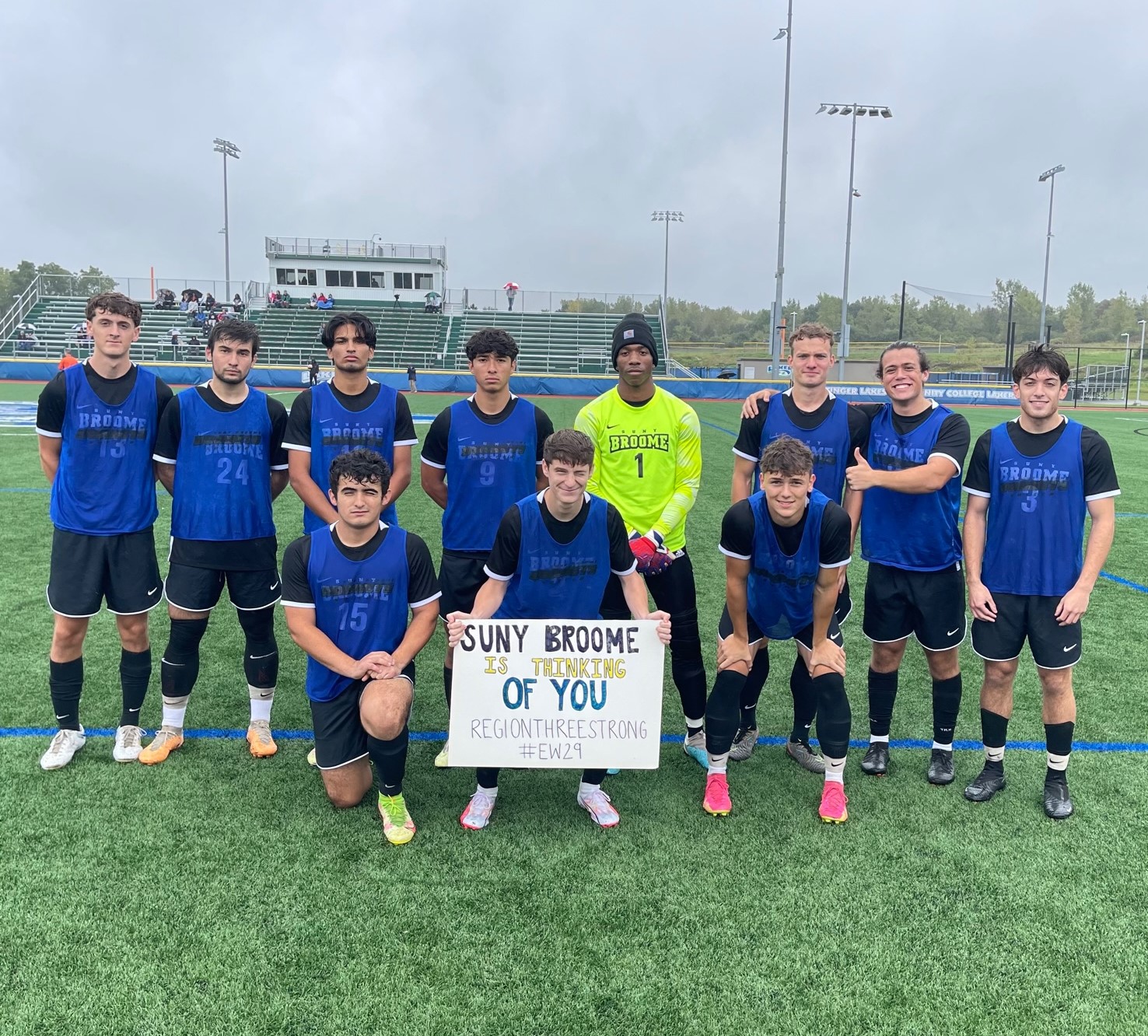 Team holding sign in support of Ethan Walker