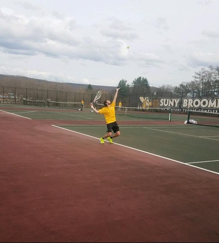 Broome player serving