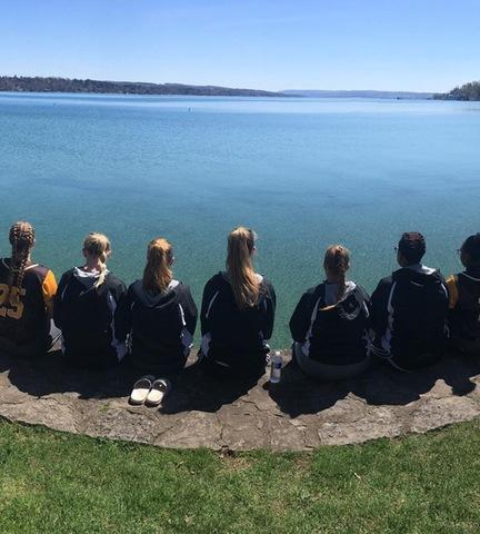 Softball team looking out at lake