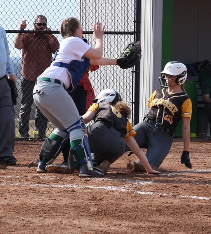 Two Broome players at sliding into home plate under tag