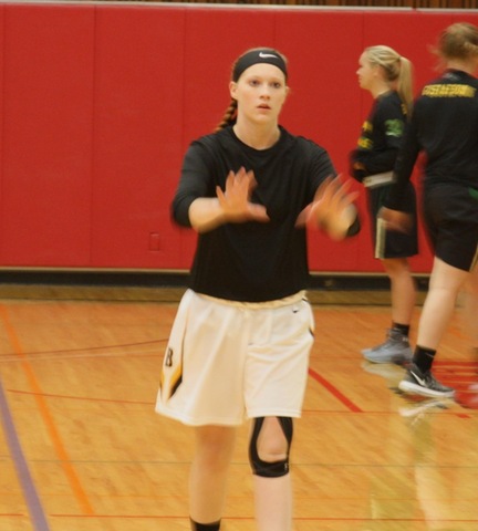 SUNY Broome women's basketball player passing ball
