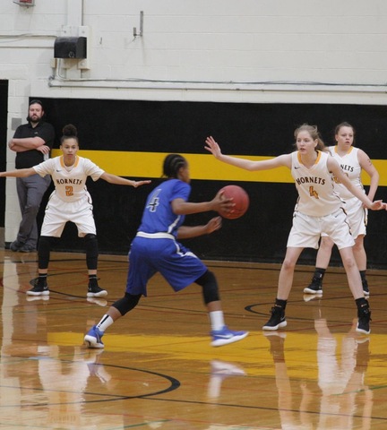 SUNY Broome women's basketball players defending their basket