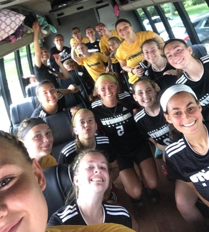 Women's soccer team on bus after win