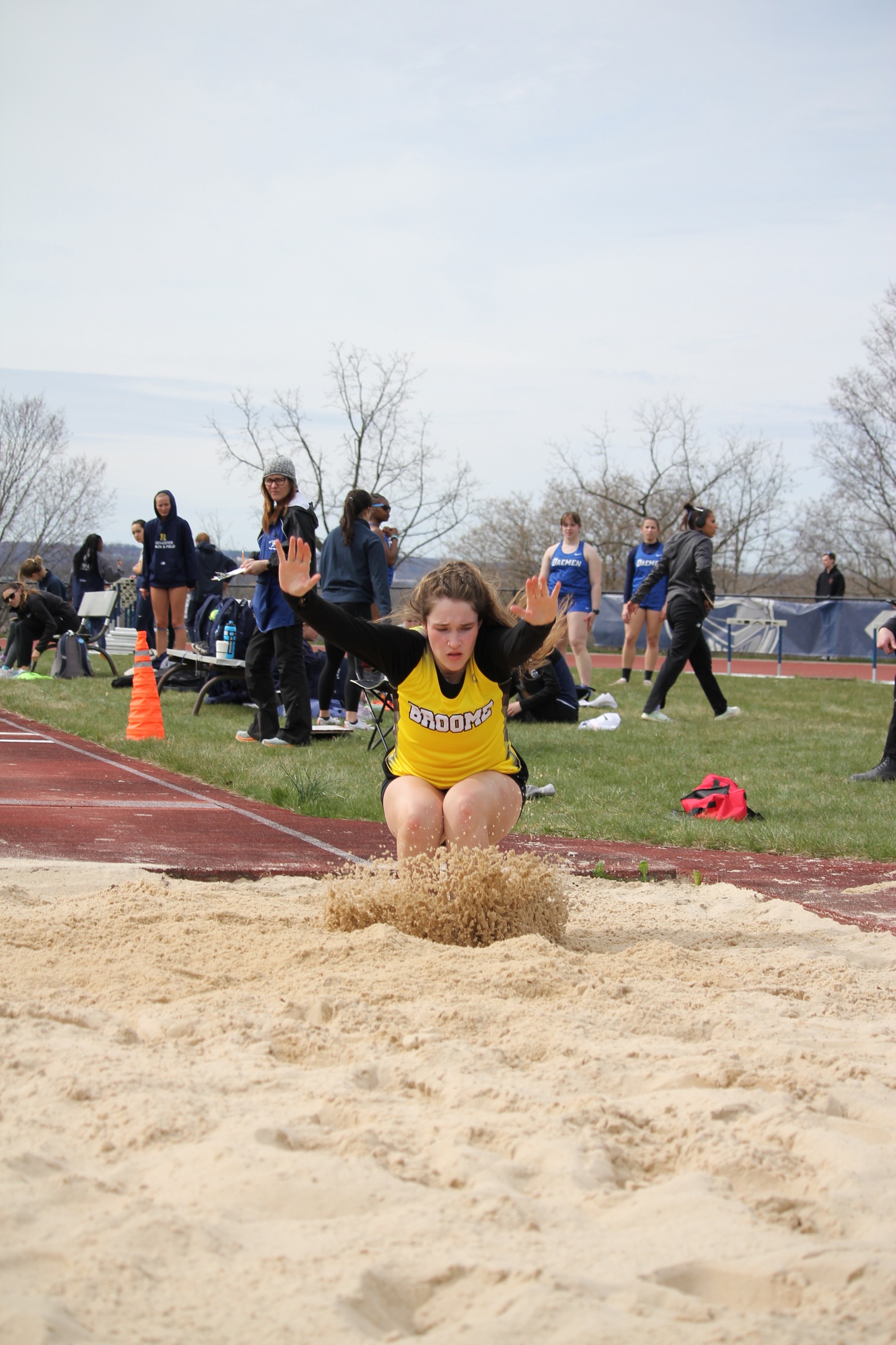 Broome track and field member jumping