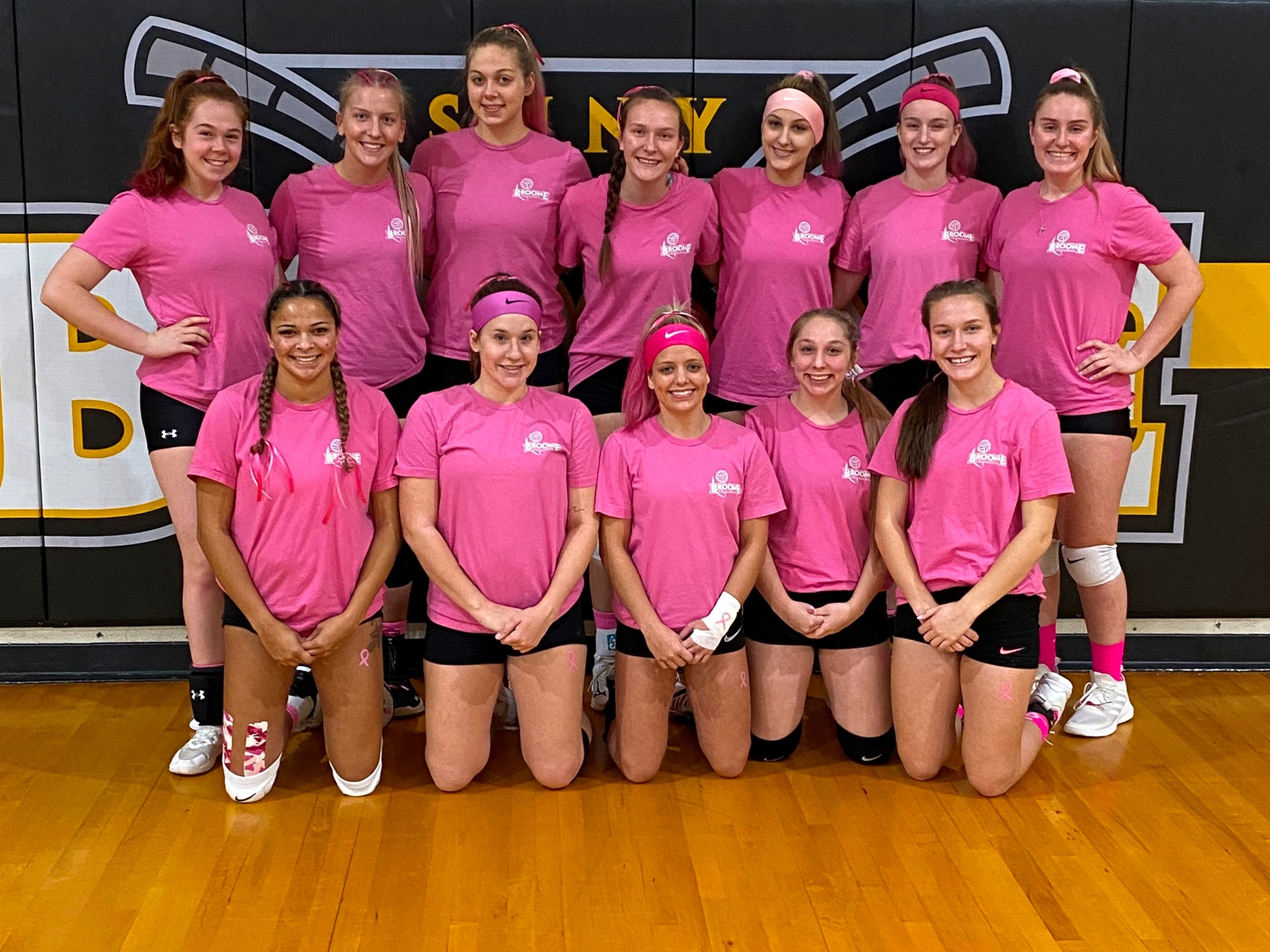 Team picture in pink shirts