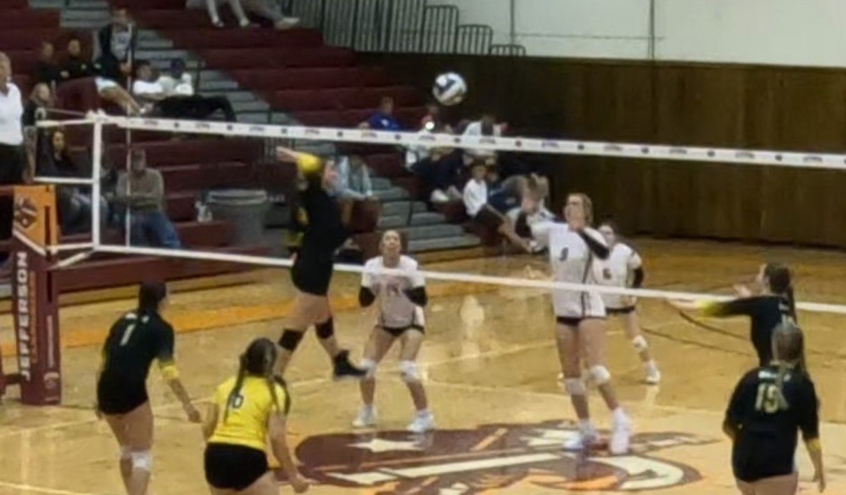 Broome player at net going up for a kill