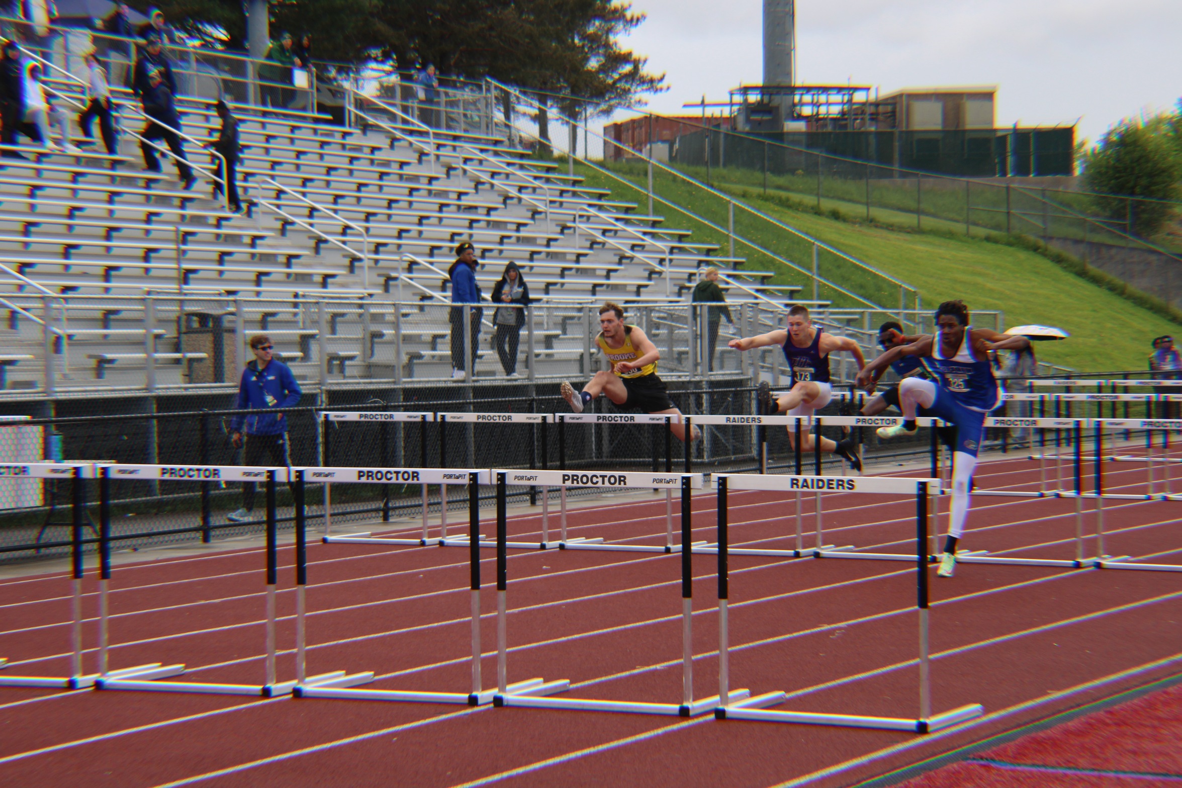 Broome track runner jumping hurdles