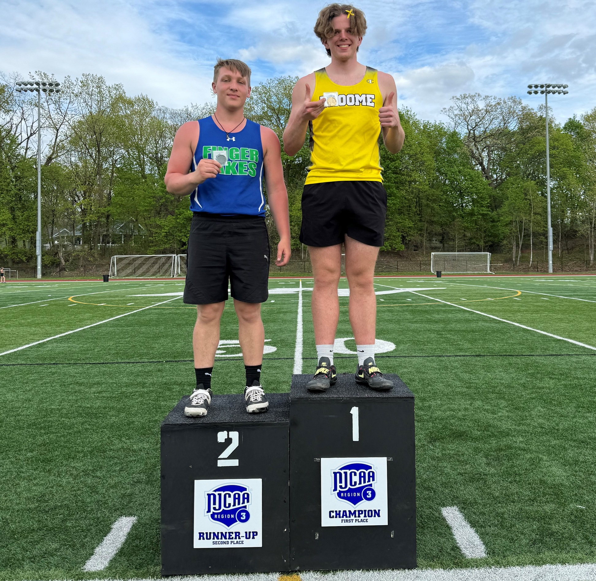 Broome athlete standing and posing on 1st place podium