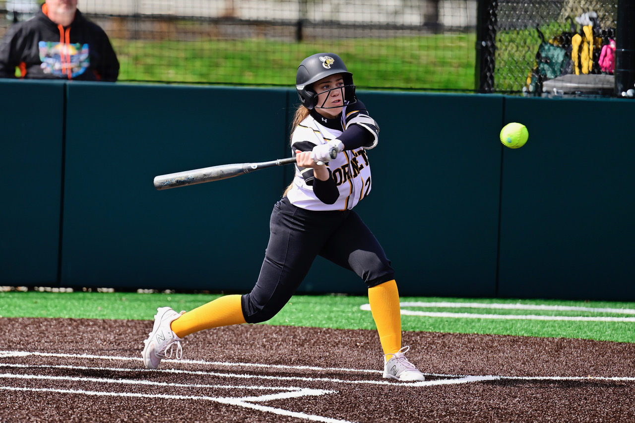 Broome softball player hitting the ball