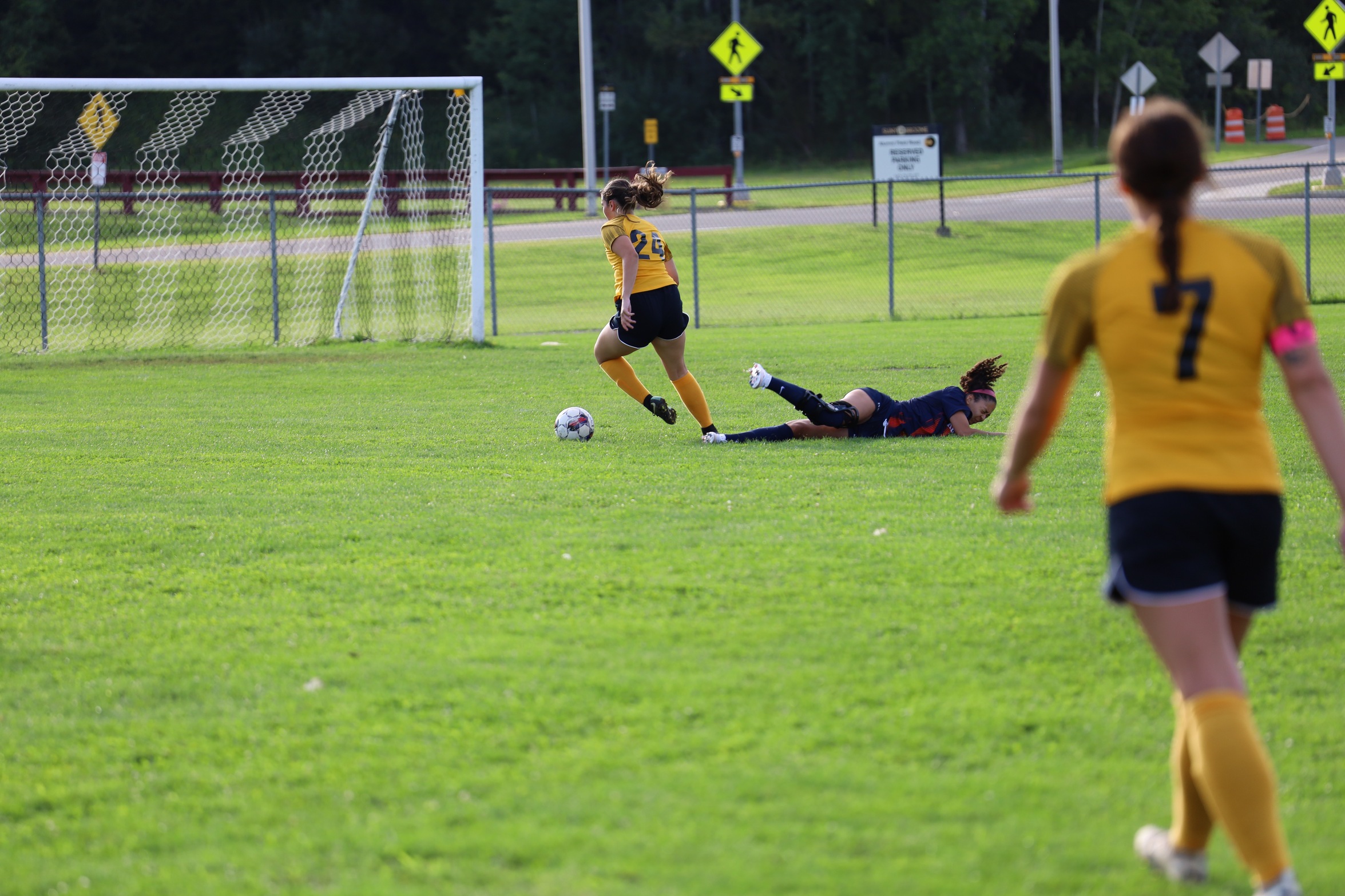 Broome soccer player dribbling soccer ball